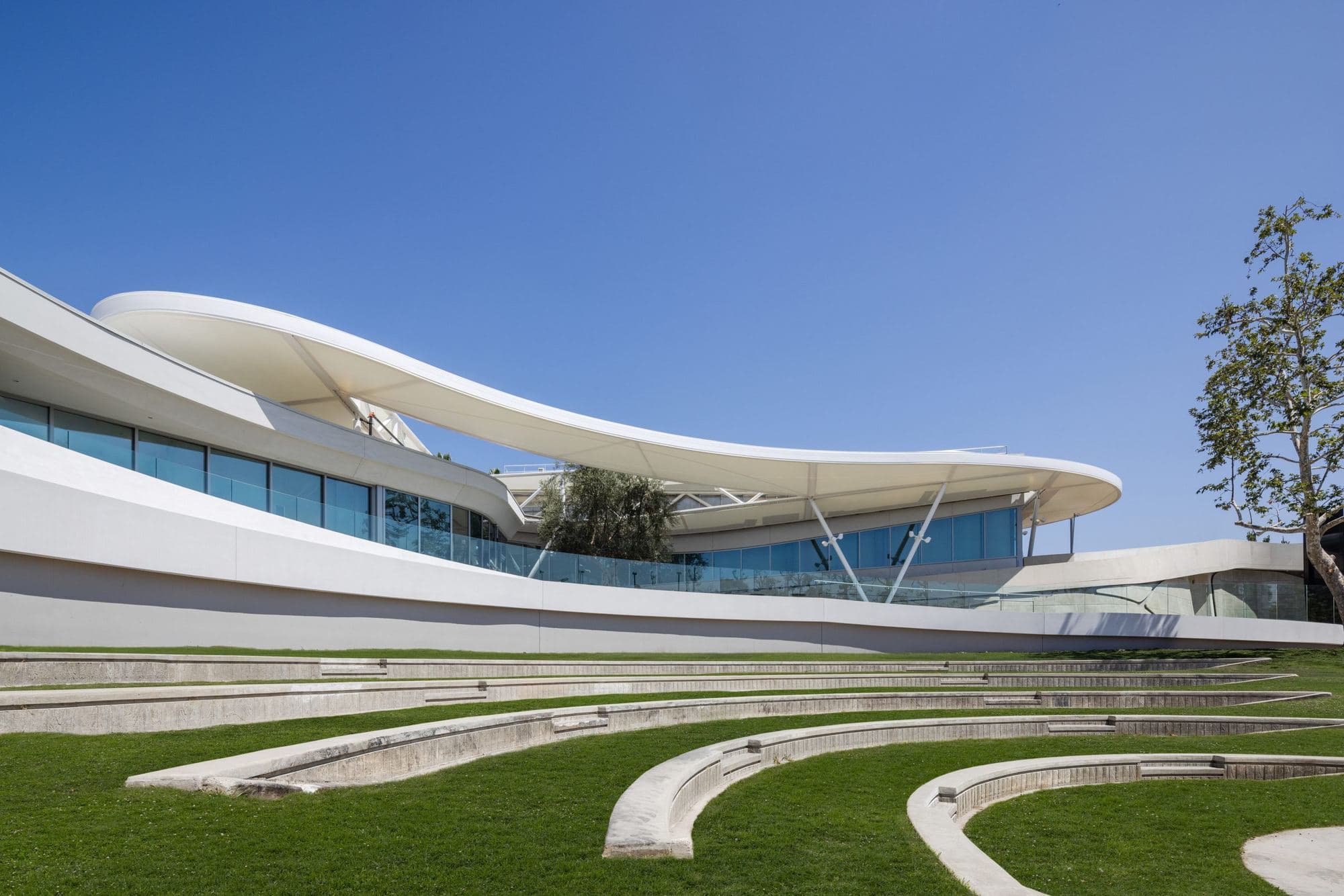 The Goldrich Cultural Center and its outdoor amphitheater on a clear day